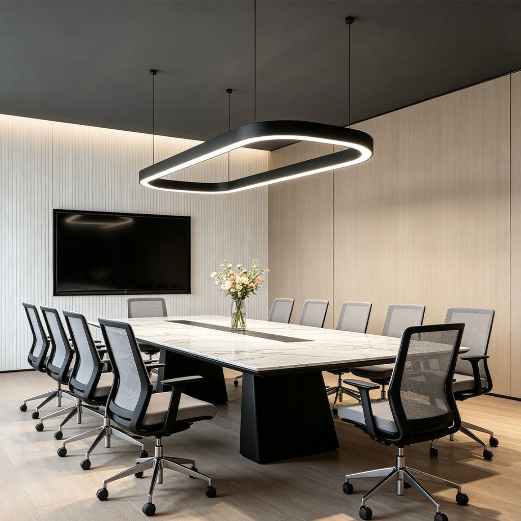 Black oval chandelier hanging above a contemporary conference room table.