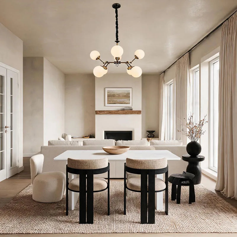 Bubble lighting chandeliers displayed in a bright dining space with symmetrical glass globes.