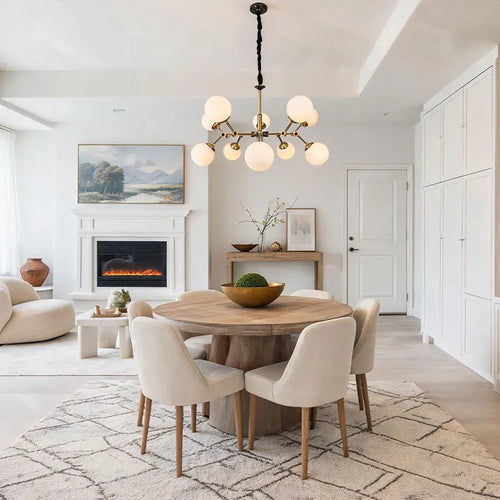 Bubble lighting chandeliers installed above a dining area with multiple round glass globe lights.