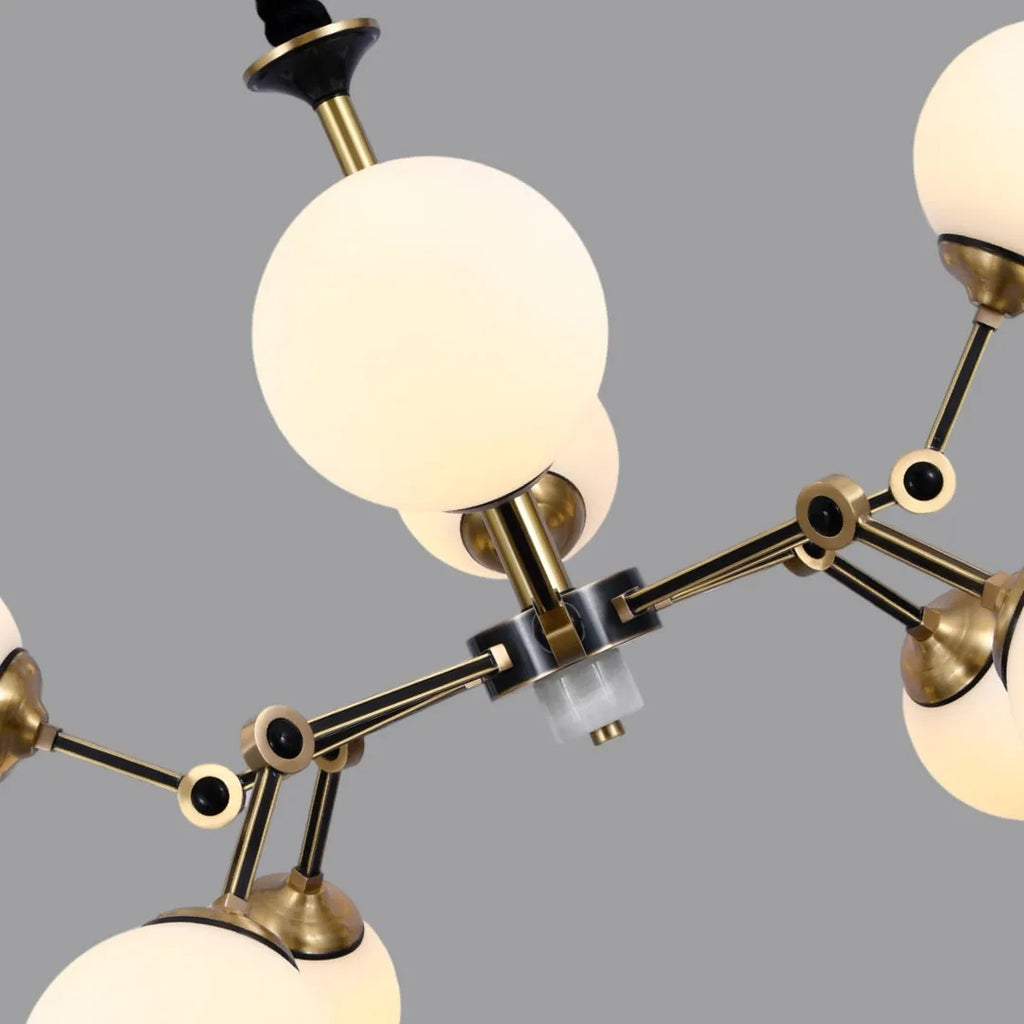 Close-up of bubble lighting chandeliers showing the gold frame, connectors, and round glass shades.
