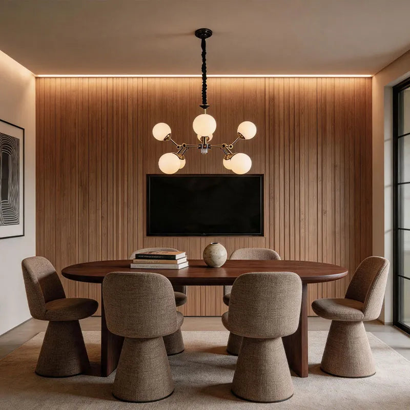 Bubble lighting chandeliers hanging in a modern dining room with warm globe illumination.