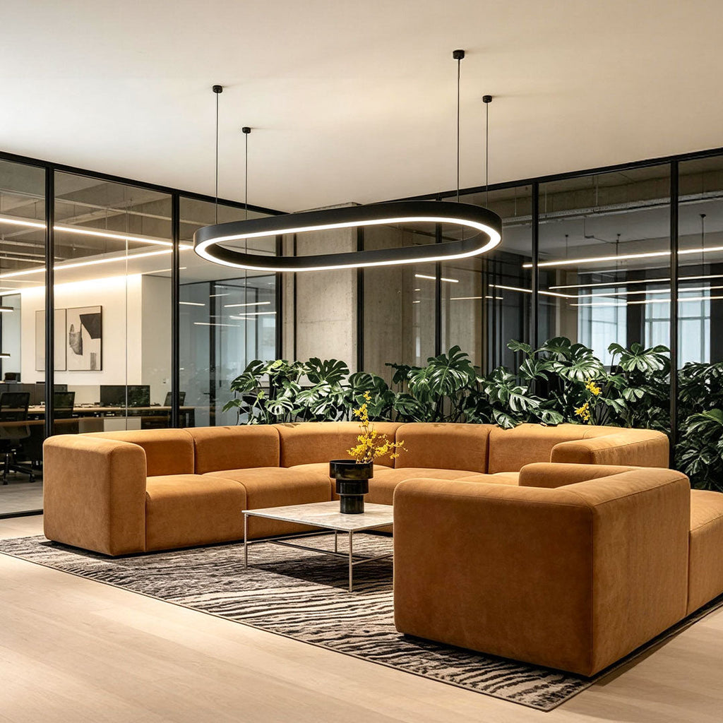 Elegant oval chandelier featured in a modern lounge and reception seating area.