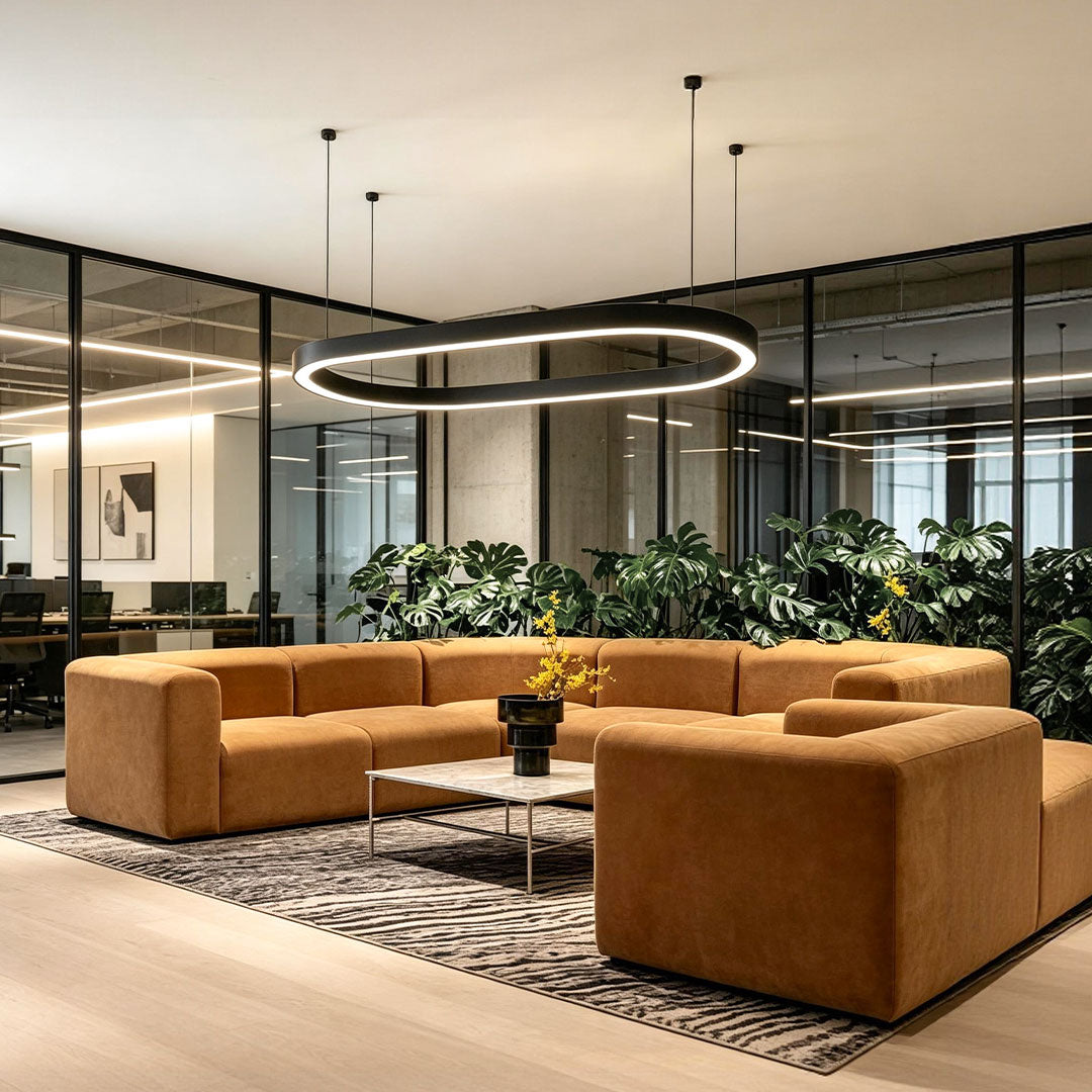 Elegant oval chandelier featured in a modern lounge and reception seating area.