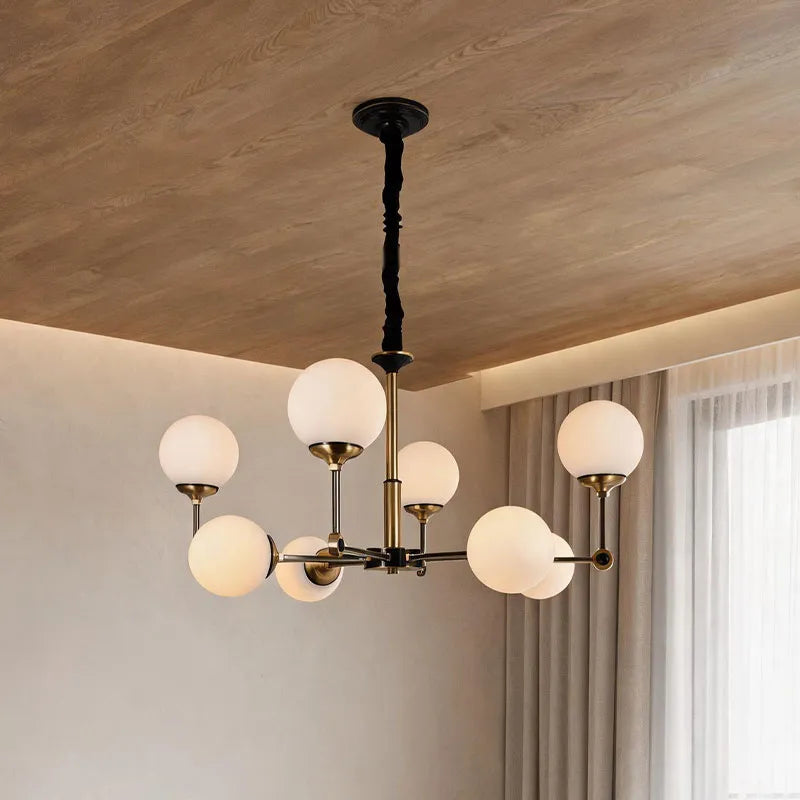 Glass ball chandelier modern featuring multiple frosted globe lights in a stylish contemporary living room.