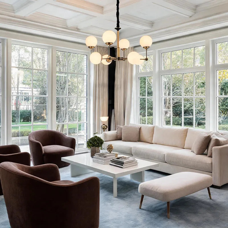Glass ball chandelier modern illuminating a luxury living space with multiple round glass shades.