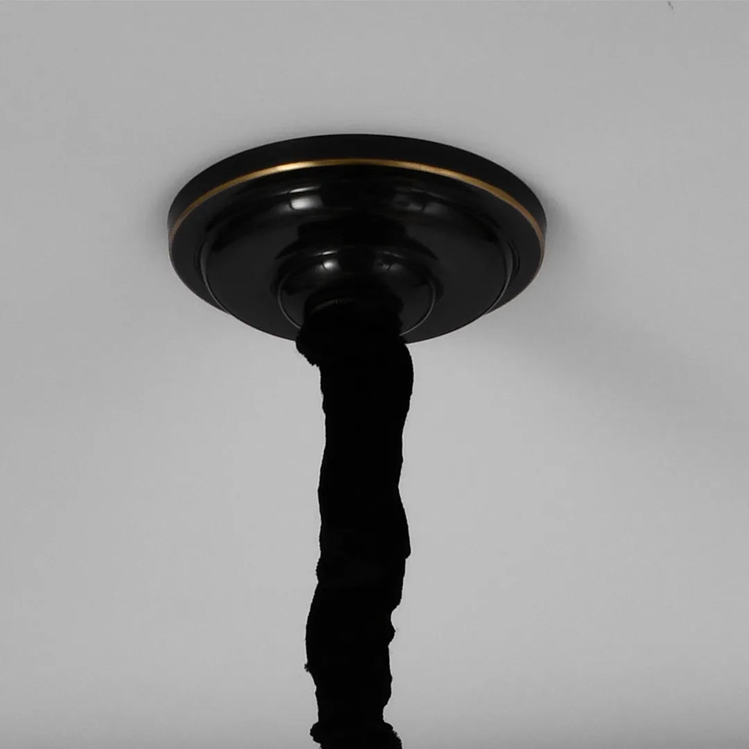 Glass ball chandelier modern close-up showing the decorative ceiling mount and black hanging rod.