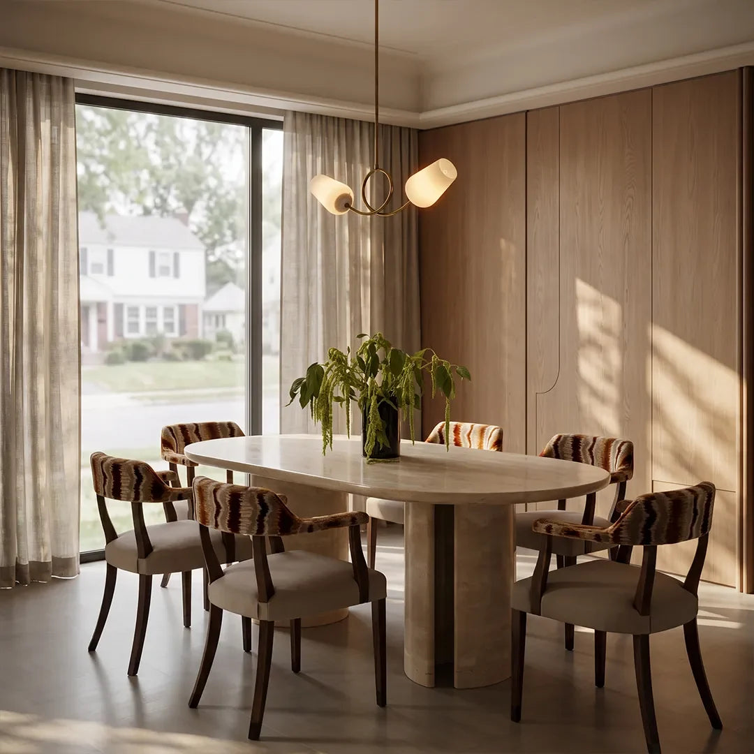 Glass vintage chandelier centered above a round dining table in a softly lit dining room.